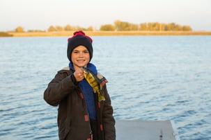 Kid holding yellow perch